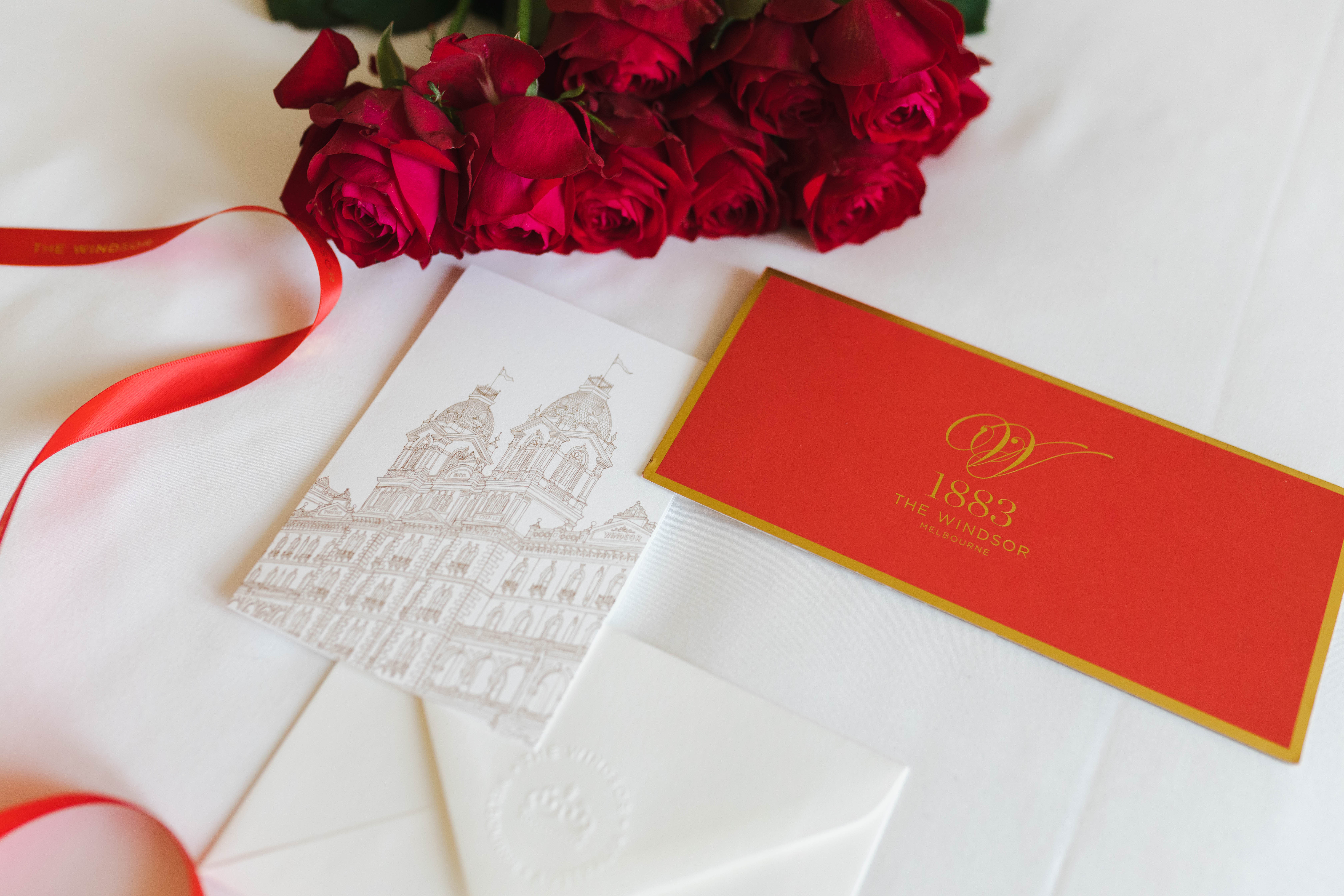 The Windsor's Red & Gold Gift Certificate with Ribbon